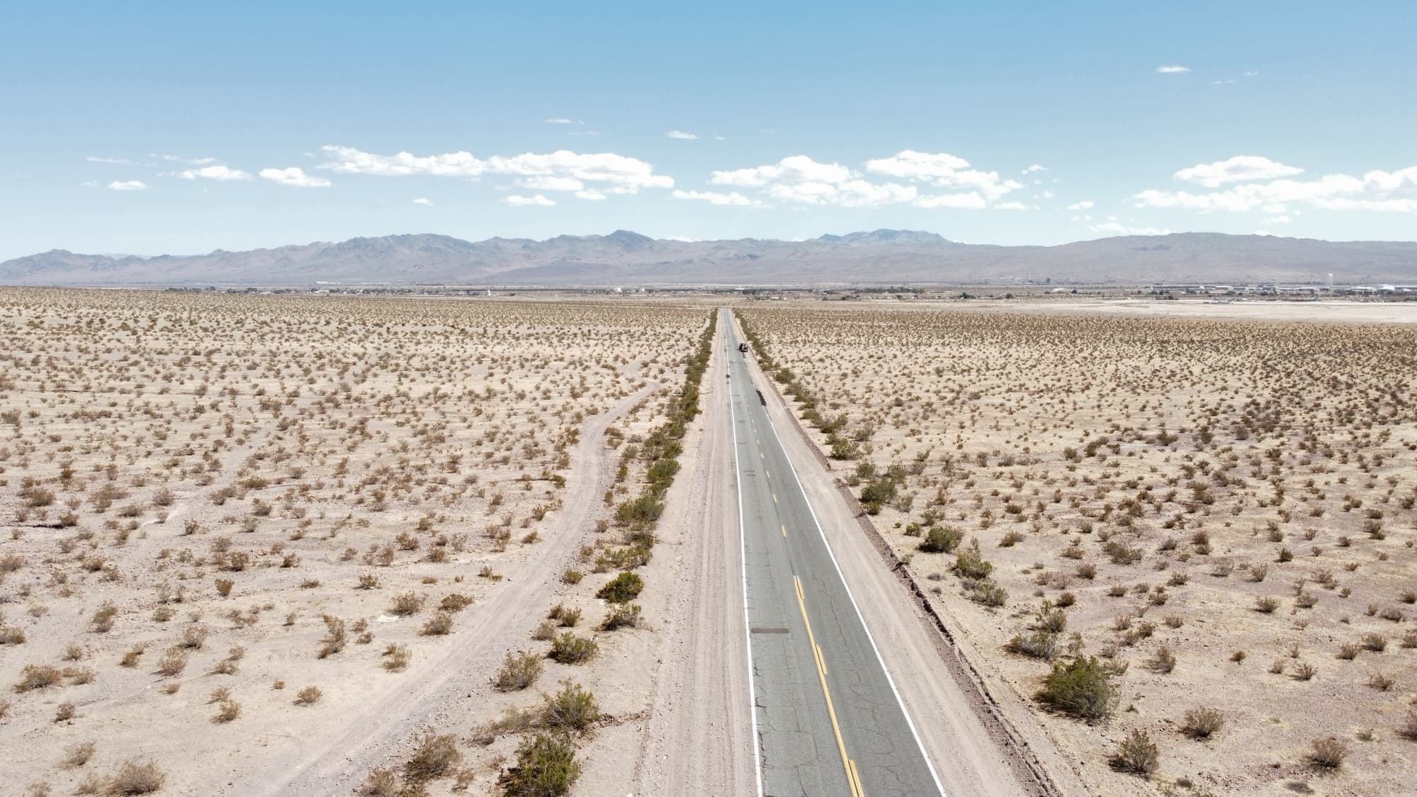 A straight desert highway photographed from directly above
